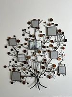 Full front view of the decorative family tree picture frame showing all ten square photo slots and detailed metal branches with circular leaf accents.