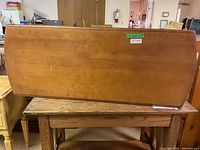 Photo of the Kroehler wooden coffee table showing the top surface and overall shape.