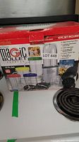 Photo of the unopened box showing the Magic Bullet 17 piece set with details of included items