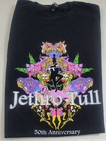 Front view of folded black Jethro Tull 50th Anniversary T-shirt with colorful symmetrical print and text.