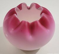 Close-up image of the Victorian pink satin glass rose bowl showing ruffled rose petal shaped rim and pink gradient color.