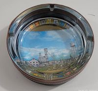 Top-down view showing the detailed colorful image of Lamaque Gold Mine inside the glass ashtray.