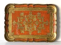 Full view of the vintage Italian Florentine rectangular tray showing central gold floral relief and scalloped edge