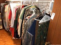 Full view of clothing rack showing assorted garments on hangers