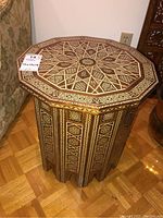 Full view of table showing octagonal top and faceted base