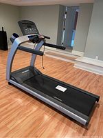 Full front perspective showing treadmill frame, running deck and console