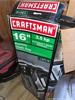 Photo of Craftsman 16" Electric Chain Saw in original box showing brand, size and power details.