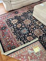 Rug under living room furniture showing central field and partial border