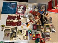 Overview of scrapbooking supplies including stamps, ink pads, Stickers, Paper Pumpkin kits items, adhesive rolls and small crafting tools.