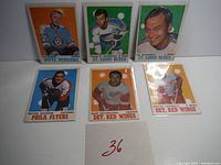 6 vintage 1970-71 O-Pee-Chee NHL hockey cards laid out on white surface with identification number card 36