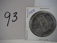 Front side showing British Columbia totem pole design with date 1858-1958 and inscriptions CANADA, BRITISH COLUMBIA, and DOLLAR.