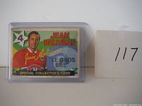 Jean Beliveau Special Collector's Card front view in plastic holder showing card details and surface wear.