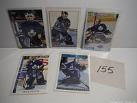Front view of five Felix Potvin hockey cards arranged side by side showing player in Toronto Maple Leafs goalie uniform