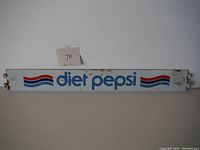 Front view of the vintage Diet Pepsi sign showing text and graphics.