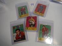 Fronts of key player cards including Bobby Orr and Stan Mikita shown in protective sleeves resting on white surface.