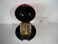 Opened Pokeball revealing detailed 23k gold Mewtwo figurine inside