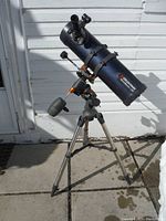 Full assembled telescope with optical tube, equatorial mount, counterweight, and tripod