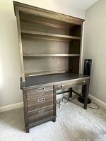 Front view of solid wood desk with built-in hutch, soft faded grey finish