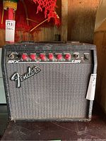 Front view of the Fender SKX 15R amplifier showing the single unit with control knobs and Fender logo.