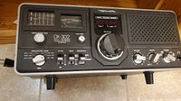 Front view of Realistic DX-302 short wave radio showing main controls and speaker.