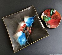 Photo showing both dishes: square fused glass with leather backing and smaller round ruffled edge glass dish