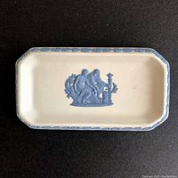Overhead photo showing the overall shape, color, and decoration of the eight-sided Wedgwood Jasperware trinket dish with central relief and laurel border.