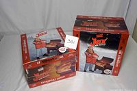 Two factory sealed boxes of Jealous Devil Jax BBQ Legendary Blend Hardwood Wood Pellets, each 20lbs, total 40lbs.
