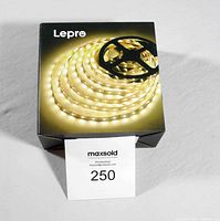 Closed box showing Lepre LED light strip packaging with image of coiled light strip emitting warm white light.
