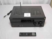 Front view of Sony STR-DN1050 AV receiver with remote control in front