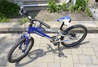 Full view of blue and silver Trek MT-60 kids mountain bike showing frame, wheels, seat, and handlebars.