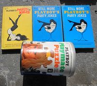 Photo showing two 'Still More Playboy's Party Jokes' blue books, one yellow 'Playboy's Party Jokes' book, and cylindrical puzzle container featuring Cynthia Myers