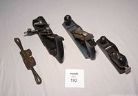 Overview of four hand woodworking tools on white background