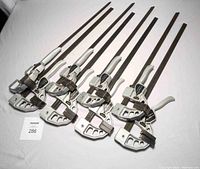 Full view of 8 identical woodworking bar clamps with 18-inch bars showing overall condition and design.
