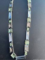 Front view of the blue fluorite and tourmaline gemstone necklace showing the rectangular and square cut stones in alternating pattern.