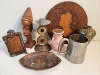 Photo of entire assortment showing vintage decorative pieces including wood carving, candlestick, vases, frames, and dish.