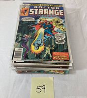 Stack of vintage comic books with Doctor Strange #1 on top