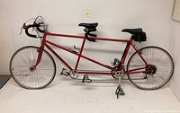 Full side view of red Santana tandem bicycle