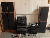 Full view of speakers, audio components, turntable, subwoofer and speaker cables