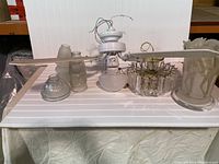 Glass lamp components including fan blades, glass shades, and metal fixture base