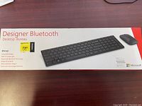 Image of Microsoft Designer Bluetooth keyboard and mouse box showing the product and key features.