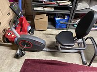 Side view of the HealthRider H22X recumbent exercise bike showing seat, pedals and frame.
