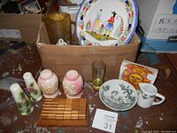 Overview photo of boxlot showing Quimper plate, Hull salt shakers, Danish bowl, wooden blocks, glassware and other vintage pottery and porcelain items