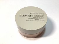 Top view of Bare Minerals Blemish Rescue loose powder foundation with lid, showing product branding and description.