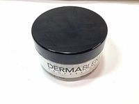 Top view of DermaBlend Professional Loose Setting Powder jar with black lid