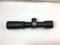 Side view of the Excalibur Tact Zone crossbow scope showing the Tact Zone logo on the adjustment turret and overall condition of the scope including wear.