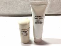 Front view of Shiseido White Lucent Brightening Cleansing Foam 30ml tube and Ibuki Refining Moisturizer Emulsion 15ml bottle