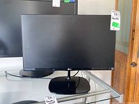 Front view of LG monitor showing 21.5 inch display, black bezel, and stand.