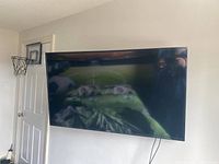 Front view of the Samsung 44″ television mounted on wall