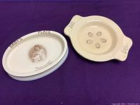 Two vintage baby plates, one oval featuring Princess Elizabeth and Princess Margaret, the other round with Dionne Quintuplets medallions.