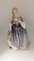Front view of the Royal Doulton figurine showing detailed dress and birds.